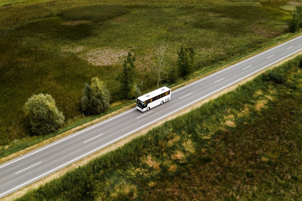 aerial view of passenger bus on road through count 2021 08 29 11 44 32 utc (1)