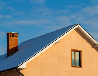 Roof of a new built house with nice window and chimney.