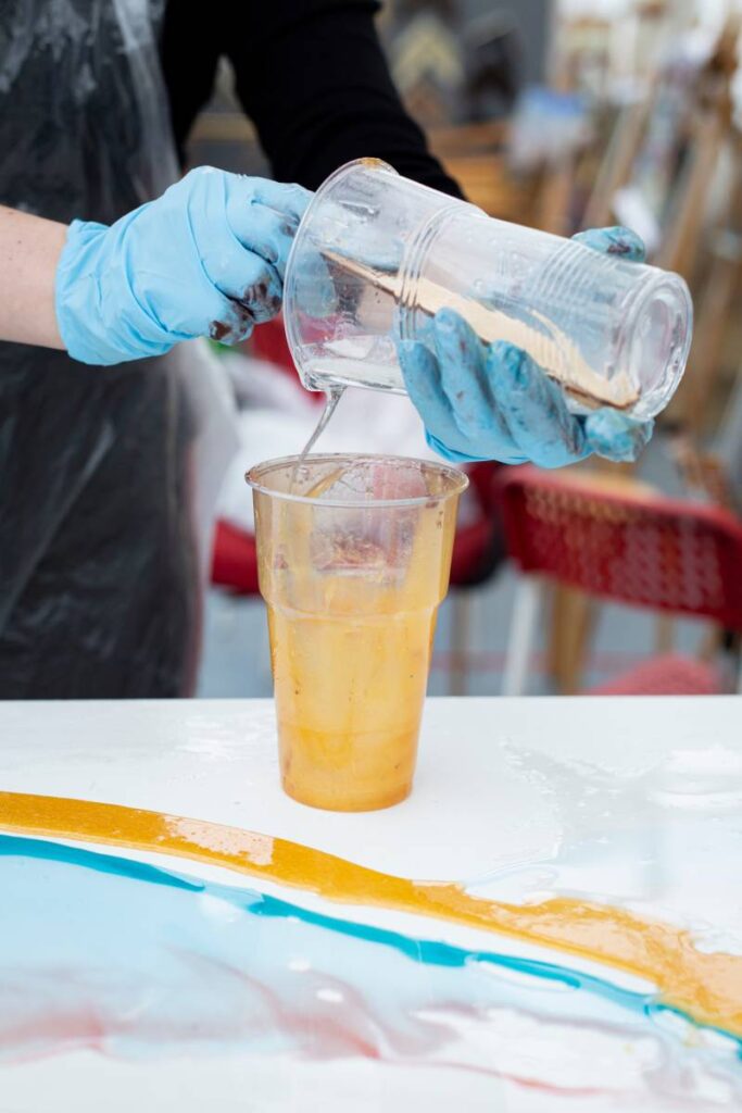 the artist mixes acrylic paints in a glass 2023 11 27 04 55 35 utc (1)