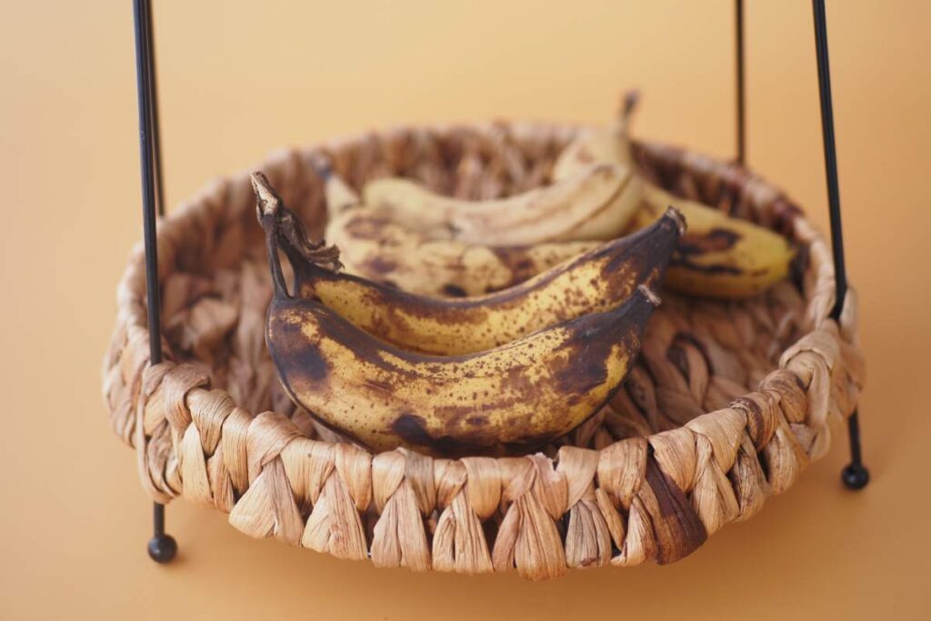 closeup of rotten banana on orange color background