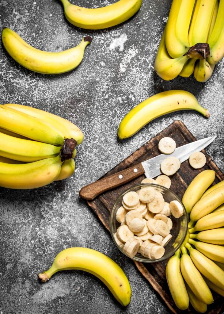 Fresh bananas with pieces of sliced bananas in a bowl.