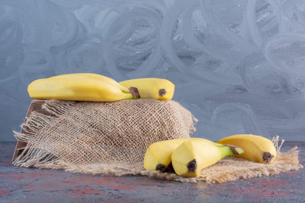 Pile of fresh yellow banana on sack
