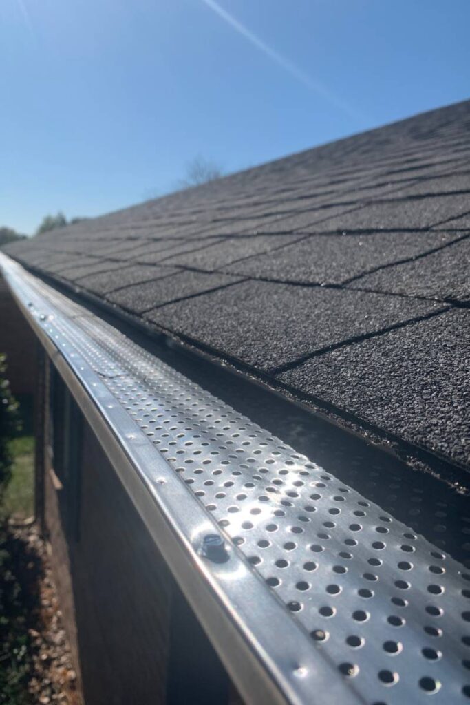 roof of a house showing gutter and gutter guard pr 2024 11 27 05 54 44 utc (1)