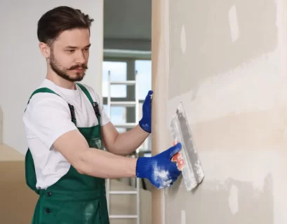 plasterer applying finish coat to wall Sydney